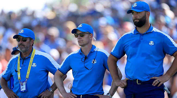 European Team captain Luke Donald of England is flanked by his vice-captain Jose Maria Olazabal (L) and Jon Rahm (R) beside the 15th green during the Friday morning foursomes matches of the 2023 Ryder Cup at Marco Simone Golf Club in Rome, Italy.